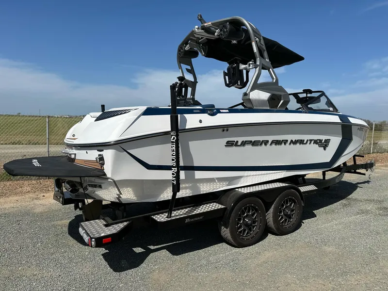 Slide: The Image of 2019 Nautique Super Air G23 boat on trailer, parked outdoors. - 6