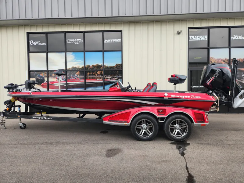 Slide: The Image of 2022 Ranger Z521L RANGER CUP EQUIPPED boat, red, on trailer, parked outside dealership. - 0