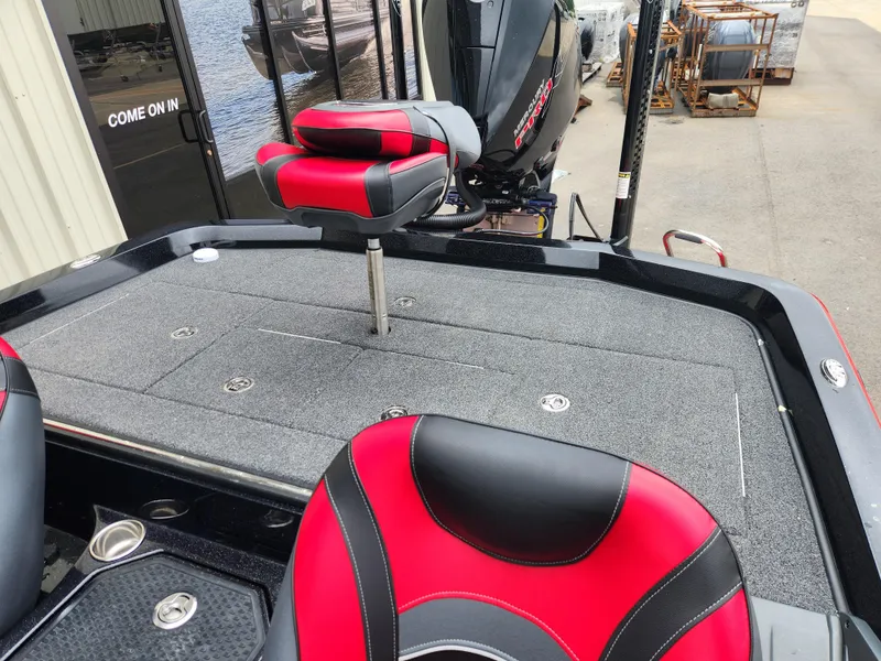 Slide: The Image of 2022 Ranger Z521L RANGER CUP boat with red and black seats, rear deck view. - 13