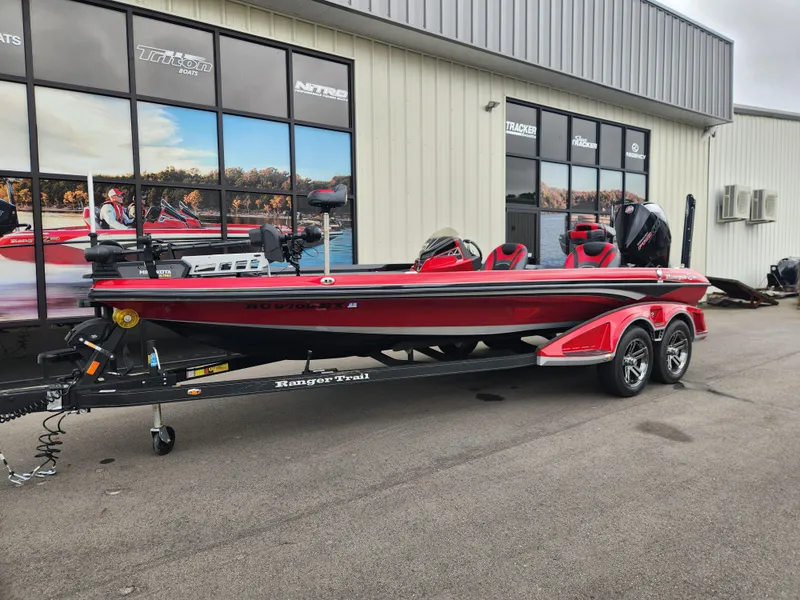 Slide: The Image of 2022 Ranger Z521L RANGER CUP EQUIPPED boat, red, parked outside a dealership. - 2