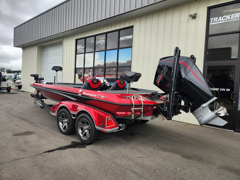 Slide: The Image of 2022 Ranger Z521L RANGER CUP EQUIPPED boat, red, parked outside a dealership. - 3