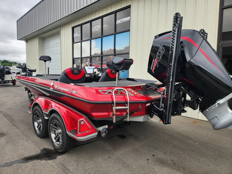 Slide: The Image of 2022 Ranger Z521L RANGER CUP EQUIPPED boat, red, parked outside a building. - 4
