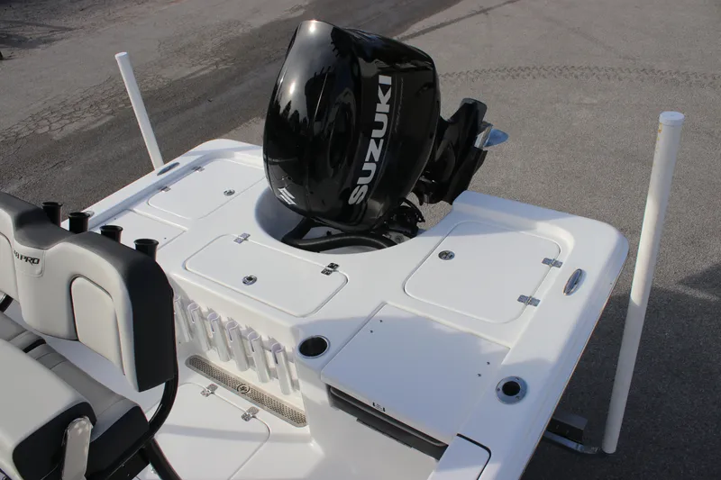 Slide: The Image of 2025 Sea Pro 210 boat with Suzuki outboard motor, featuring a sleek white deck design. - 12