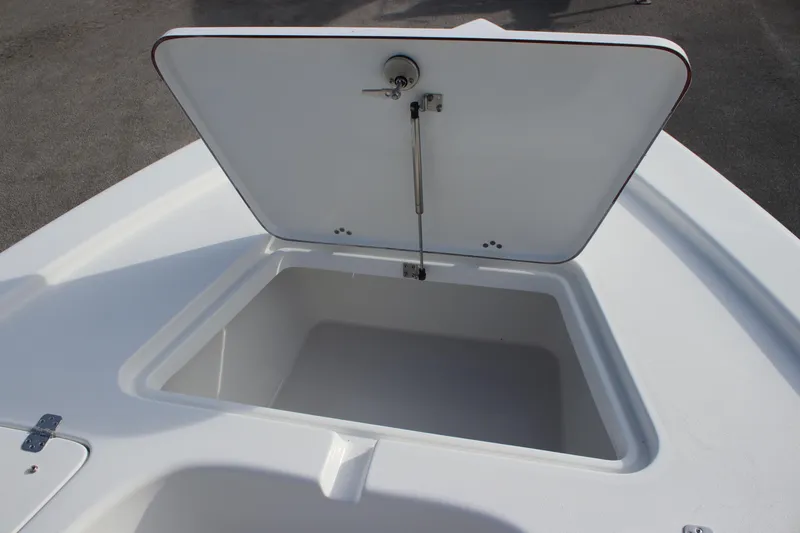 Slide: The Image of Open storage compartment on 2025 Sea Pro 210 boat deck. - 14