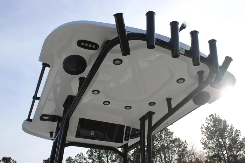 Slide: The Image of T-top of 2025 Sea Pro 210 boat with rod holders and integrated lighting. - 20