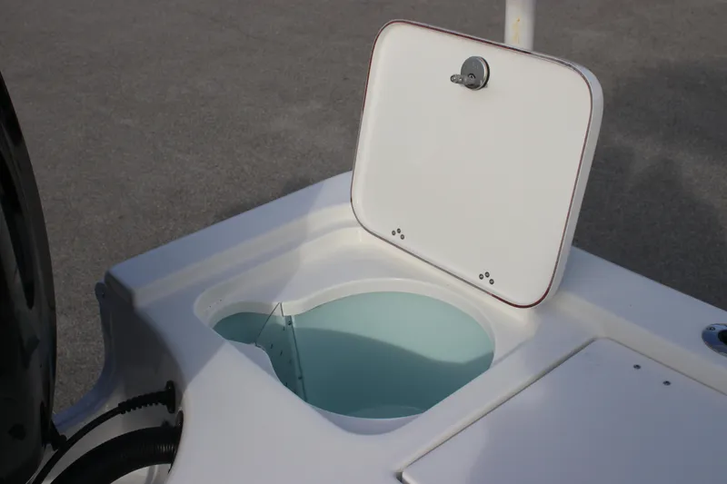 Slide: The Image of Open storage compartment on 2025 Sea Pro 210 boat deck. - 21