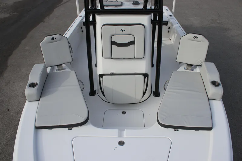 Slide: The Image of 2025 Sea Pro 210 boat interior with cushioned seating and storage compartments. - 24