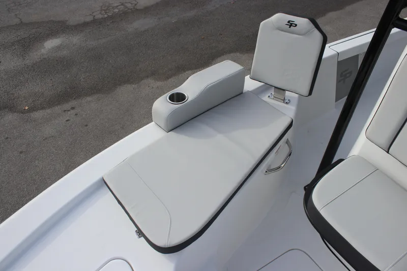 Slide: The Image of 2025 Sea Pro 210 boat seating with cup holder, featuring sleek gray upholstery. - 25