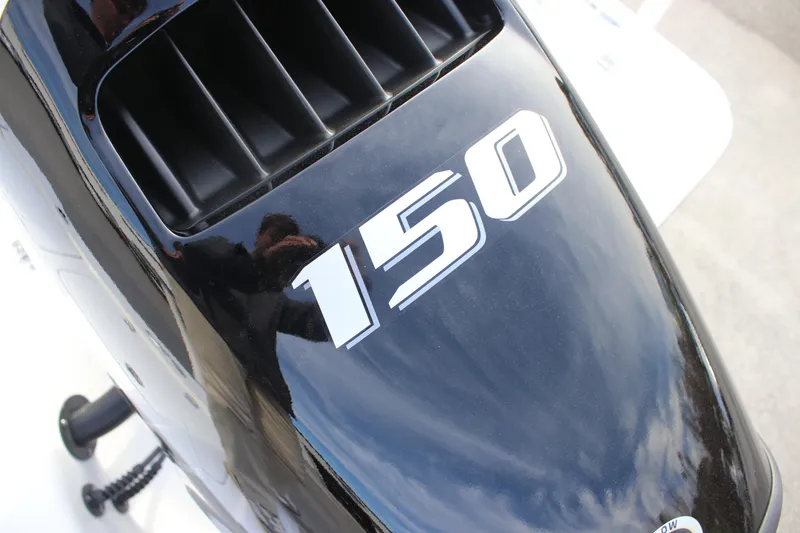 Slide: The Image of Close-up of a 150 horsepower engine on a 2025 Sea Pro 210 boat. - 27