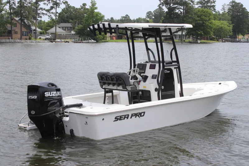 Slide: The Image of 2025 Sea Pro 210 boat with Suzuki engine on a calm lake. - 3