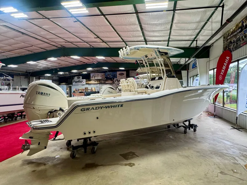 The Image of 2025 Grady-White Fisherman 236 boat in showroom with Yamaha engines. - 1