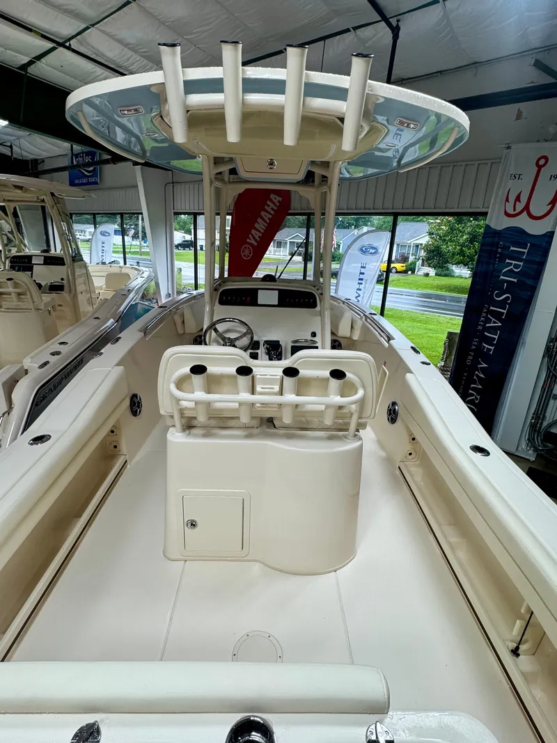 Slide: The Image of 2025 Grady-White Fisherman 236 boat interior with helm and rod holders. - 3