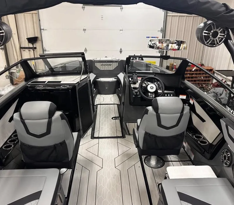 Slide: The Image of Interior of 2025 Yamaha Boats 222XD, featuring modern seating and sleek dashboard design. - 3