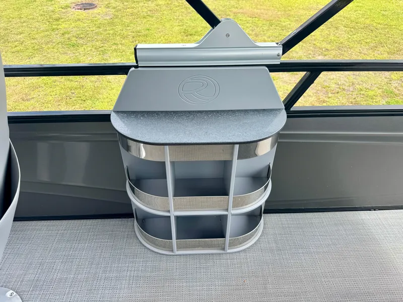 Slide: The Image of Storage compartment on a 2022 Regency 230 LE3 boat, featuring sleek design and durable materials. - 20