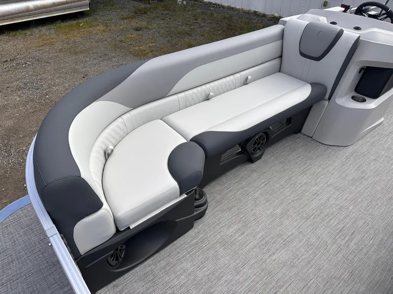 Slide: The Image of 2025 Tahoe Pontoon LTZ Cruise interior with gray and black seating on a carpeted deck. - 5