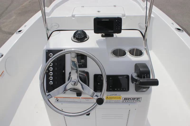 Slide: The Image of 2025 Sea Pro 172 boat console with steering wheel, controls, and navigation system. - 12
