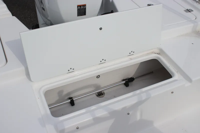 Slide: The Image of 2025 Sea Pro 172 boat storage compartment with open lid, showcasing interior details. - 4