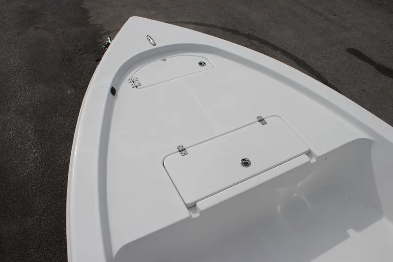Slide: The Image of 2025 Sea Pro 172 boat deck with storage compartments, shown on a concrete surface. - 5