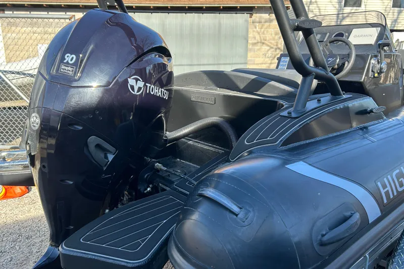 Slide: The Image of 2025 Highfield Sport 520 boat with Tohatsu 90 engine, featuring sleek design and modern equipment. - 9