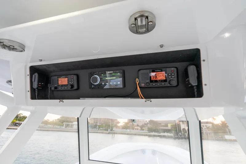 Slide: The Image of 2022 Onslow Bay 41 TE boat dashboard with electronic controls and navigation system. - 13