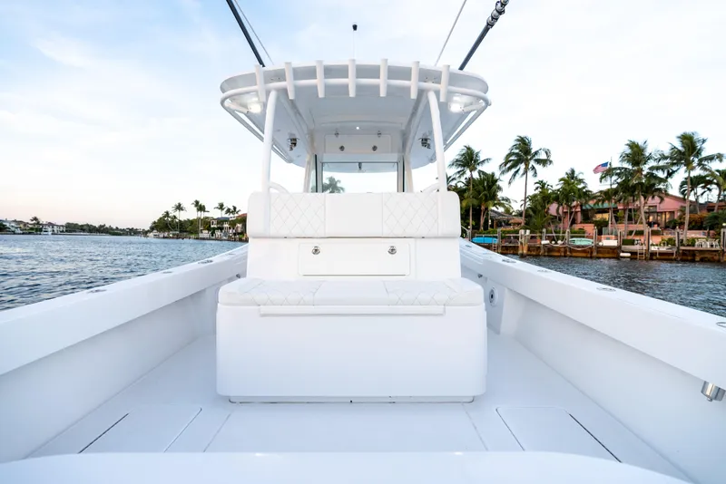 Slide: The Image of 2022 Onslow Bay 41 TE boat on water, featuring spacious deck and seating. - 17