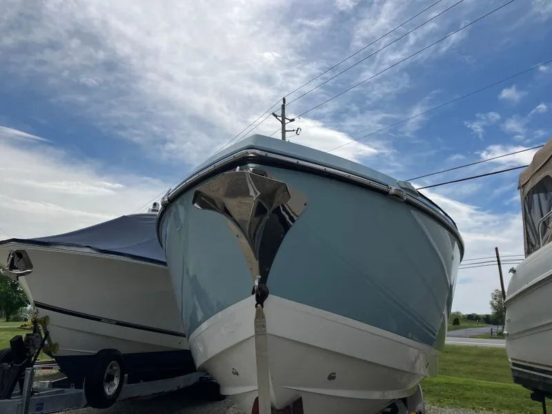 Slide: The Image of 2022 Aviara AV32 OB boat on display under a partly cloudy sky. - 11