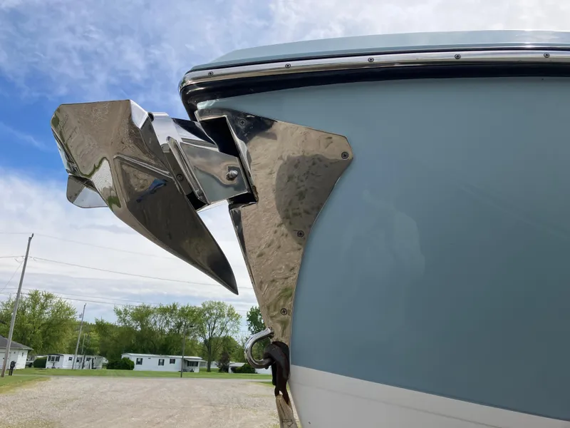 Slide: The Image of 2022 Aviara AV32 OB boat with polished anchor detail against a clear sky. - 12