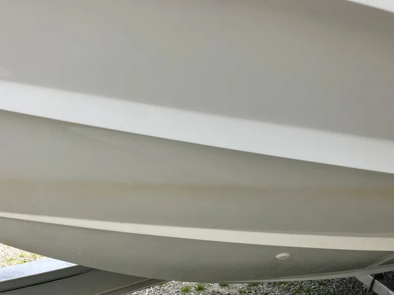 Slide: The Image of 2022 Aviara AV32 OB boat hull, close-up view, showcasing sleek design and craftsmanship. - 13