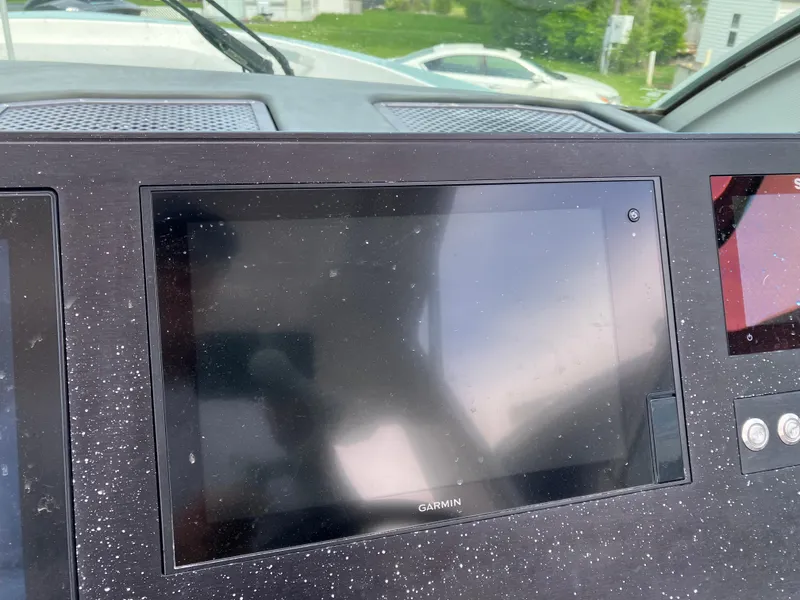 Slide: The Image of Garmin display on 2022 Aviara AV32 OB boat dashboard, showing reflections. - 27