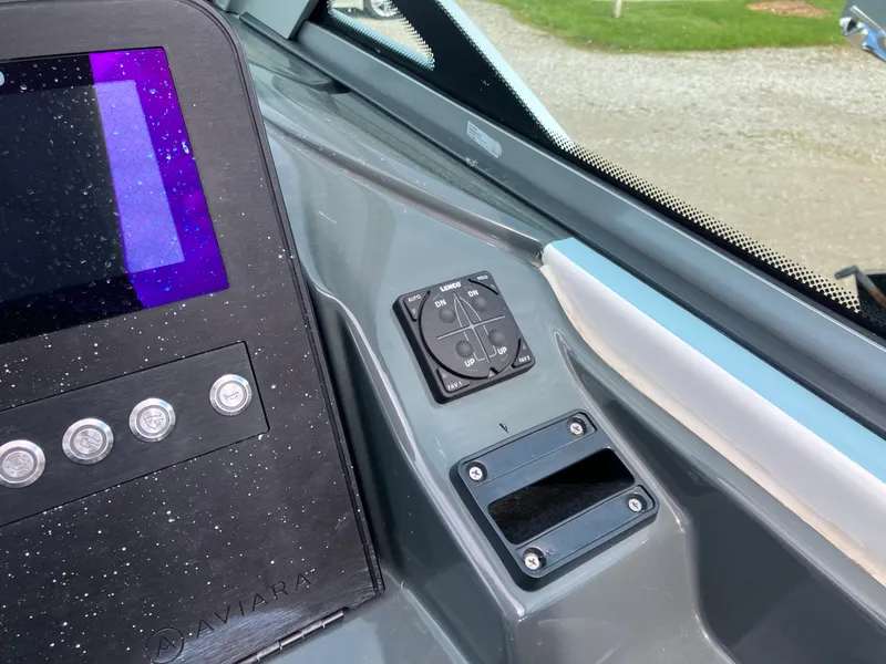 Slide: The Image of Control panel of 2022 Aviara AV32 OB boat with digital display and buttons. - 28