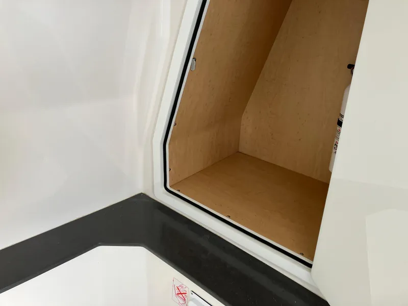 Slide: The Image of Storage compartment in 2022 Aviara AV32 OB boat, featuring sleek interior design. - 37