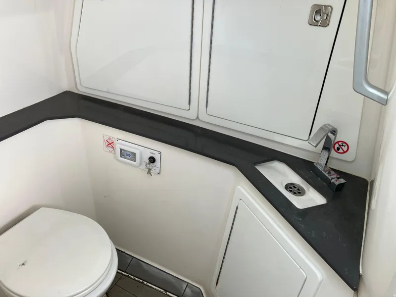 Slide: The Image of 2022 Aviara AV32 OB boat bathroom with sink and toilet. - 38