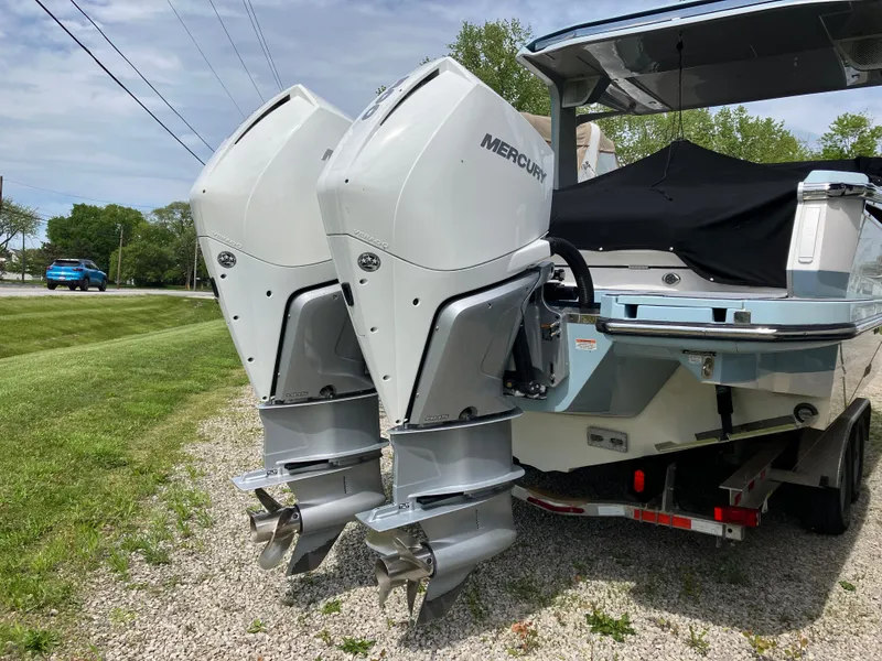 Slide: The Image of 2022 Aviara AV32 OB boat with dual Mercury outboard engines on a trailer. - 4