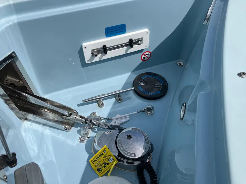 Slide: The Image of 2022 Aviara AV32 OB boat anchor compartment with winch and cleat. - 44