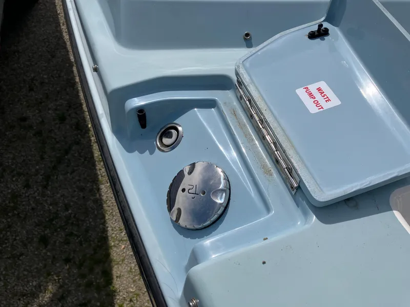 Slide: The Image of 2022 Aviara AV32 OB boat fuel cap and waste pump-out access. - 46