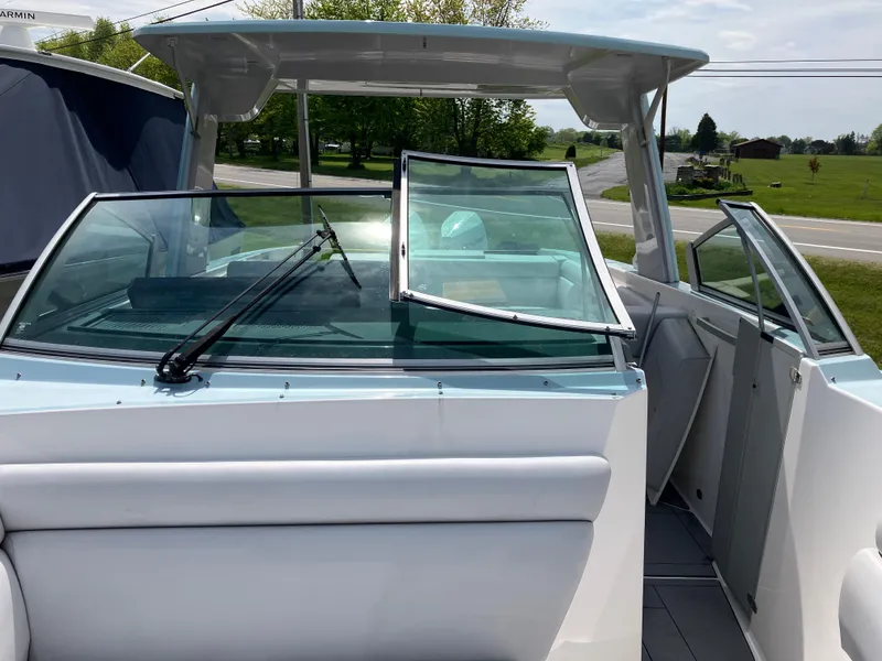 Slide: The Image of 2022 Aviara AV32 OB boat with open windshield, showcasing sleek design and spacious interior. - 47