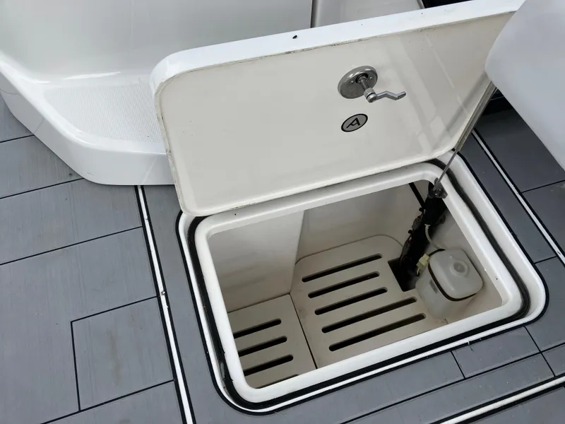 Slide: The Image of Open storage compartment on 2022 Aviara AV32 OB boat deck. - 49