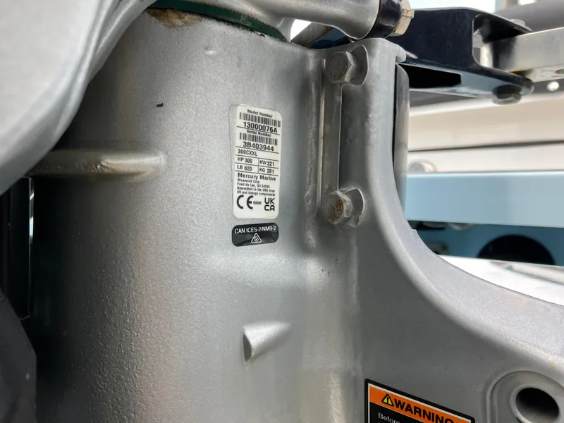 Slide: The Image of Close-up of a 2022 Aviara AV32 OB engine component with warning labels and serial number. - 5