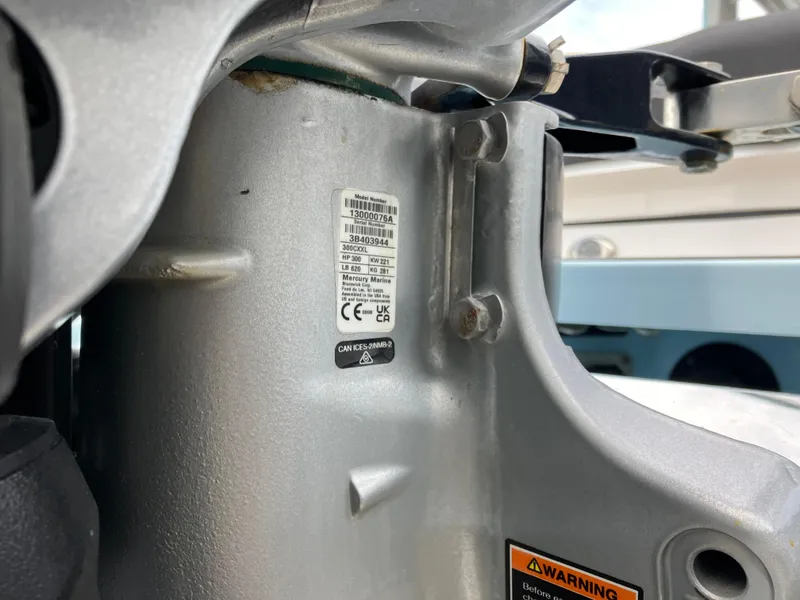 Slide: The Image of Close-up of a 2022 Aviara AV32 OB engine component with warning labels. - 6