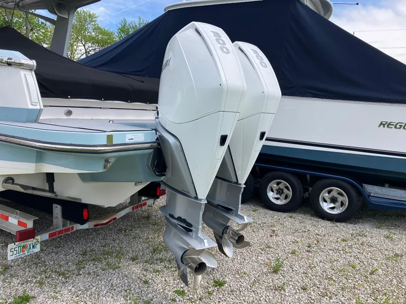 Slide: The Image of 2022 Aviara AV32 OB boat with dual outboard engines on a trailer. - 7