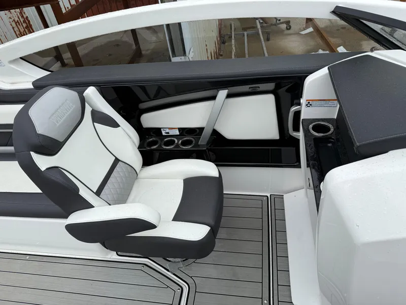 Slide: The Image of 2021 Yamaha Boats 275SE interior with sleek seating and modern dashboard design. - 6