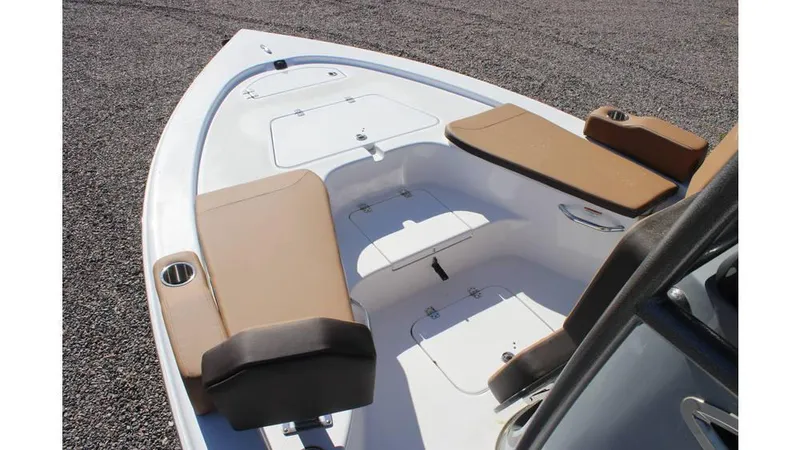 Slide: The Image of 2025 Sea Pro 230 Bay boat interior with tan seating and storage compartments. - 10