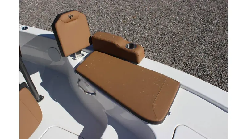 Slide: The Image of 2025 Sea Pro 230 Bay boat with brown cushioned seating and cup holder. - 9