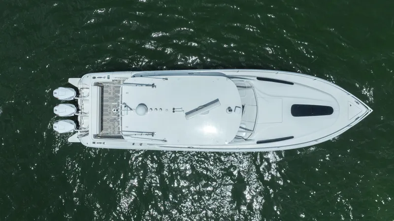 Slide: The Image of Aerial view of 2013 Intrepid 400 Cuddy boat on green water. - 11