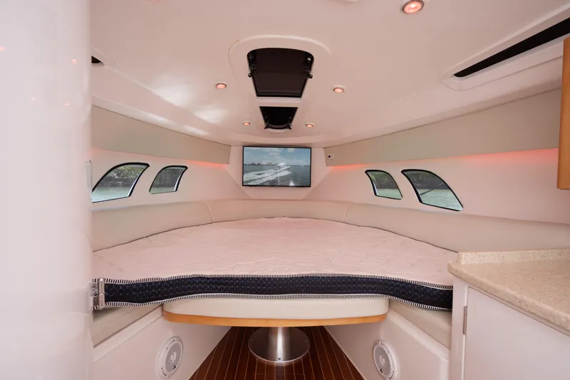Slide: The Image of 2013 Intrepid 400 Cuddy interior with cozy seating and modern design. - 24