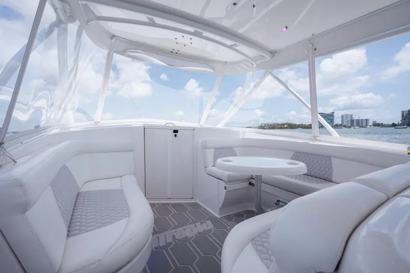 Slide: The Image of Luxurious 2013 Intrepid 400 Cuddy interior with white seating and ocean view. - 31