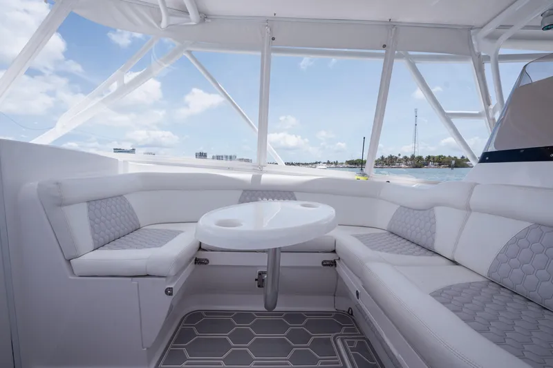 Slide: The Image of Luxurious seating area on a 2013 Intrepid 400 Cuddy boat with ocean view. - 32
