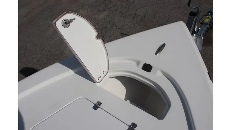 Slide: The Image of 2025 Sea Pro 210 boat storage compartment with open hatch on deck. - 10