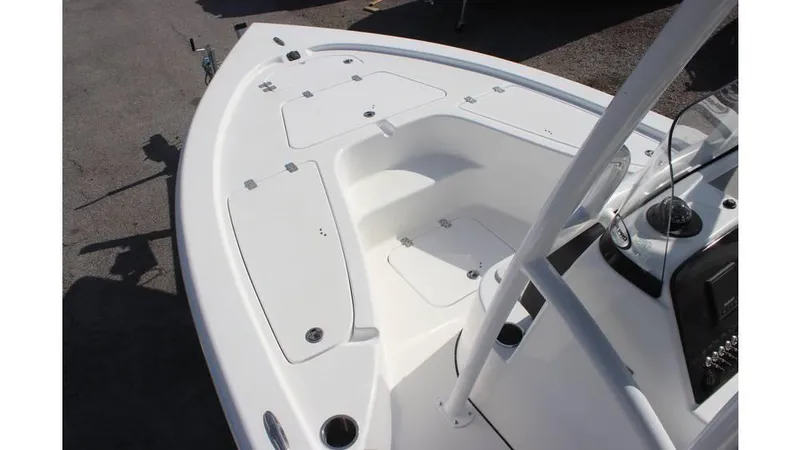 Slide: The Image of 2025 Sea Pro 210 boat deck with storage compartments and control panel. - 11
