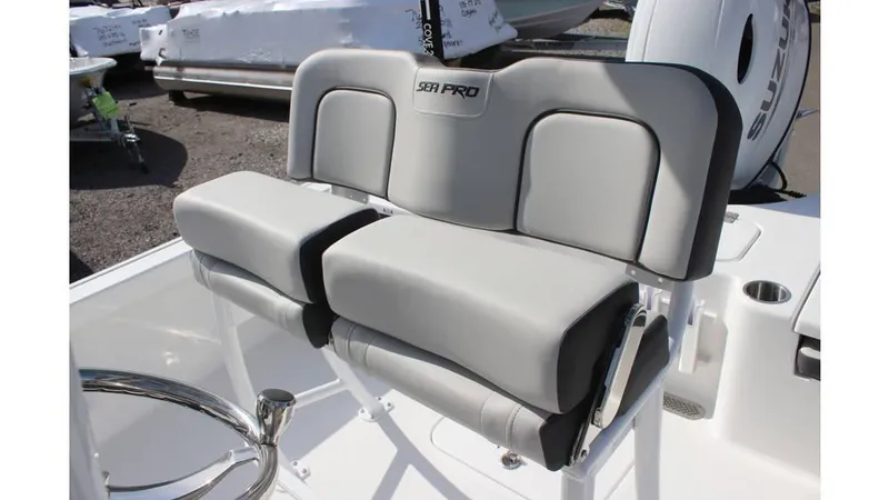 Slide: The Image of 2025 Sea Pro 210 boat seating with gray cushioned design. - 14